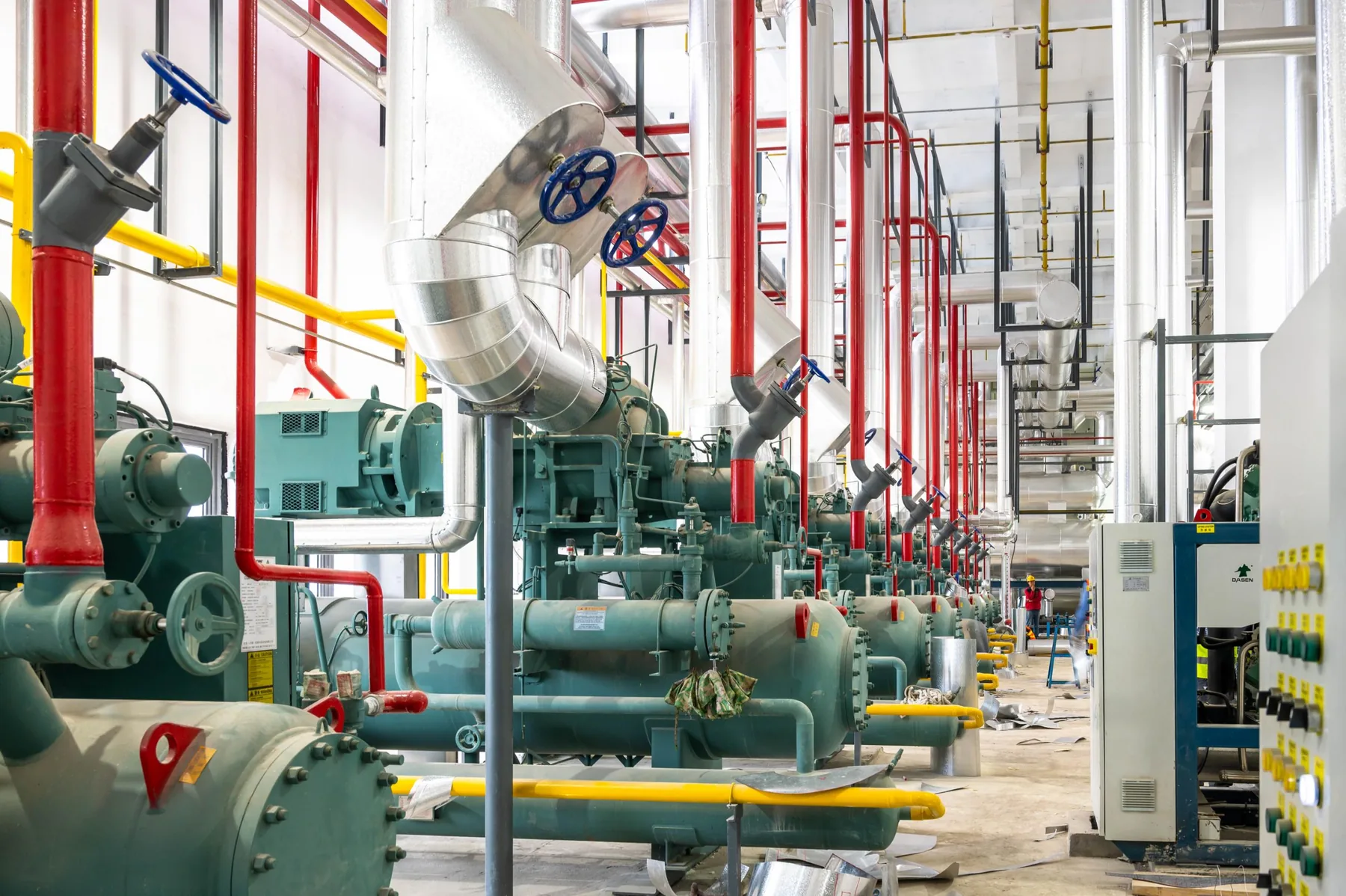 Industrial refrigeration plant room with distribution piping